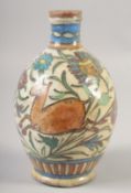 AN ISLAMIC GLAZED POTTERY BOTTLE VASE, 21cm high.