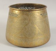 AN ISLAMIC ENGRAVED AND CHASED CALLIGRAPHIC BOWL, 23cm diameter.