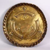 A 19TH CENTURY ISLAMIC TURKISH BRASS MOULDED CALLIGRAPHIC DISH, with moulded bands of calligraphy