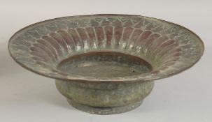 AN EMBOSSED TINNED COPPER BOWL, 31cm diameter.