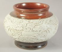 A CHINESE CARVED DRAGON JAR, character mark to base, 25cm diameter.
