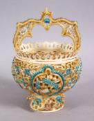 AN ISLAMIC ZSOLNAY OPENWORK PORCELAIN FORMED CASKET, with turquoise and gilded decoration, 18cm x