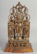 A CHINESE GILT BRONZE GOD GROUP with two attendants. 1ft high.