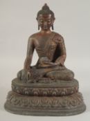 A GILT BRONZE SHAKYAMUNI BUDDHA, 31.5cm high.