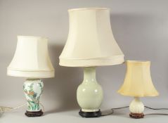 A FAMILLE VERTE PORCELAIN LAMP, together with a celadon porcelain lamp and another lamp, (3).