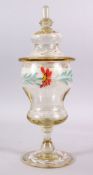 A 19TH CENTURY ENAMELLED GLASS VASE & COVER, with enamel floral decoration and gilt highlights, 41cm