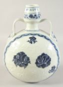 A CHINESE BLUE AND WHITE TWIN HANDLE MOON FLASK, with carved flora, 30.5cm high.