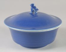 A CHINESE POWDER BLUE GLAZE BOWL AND COVER, the cover with moulded bird finial, bearing Yongxheng