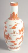 A CHINESE CORAL RED AND WHITE PORCELAIN VASE, painted with dragons and the flaming pearl of