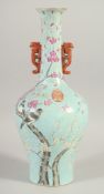 A CHINESE BLUE GROUND PORCELAIN TWIN HANDLE VASE, decorated with birds on a branch, four-character