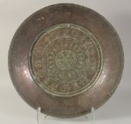 A LARGE ENGRAVED TINNED COPPER DISH, 45.5cm diameter.