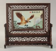 A CHINESE WOODEN TABLE SCREEN, with embroidered panel of an eagle, 39cm wide.