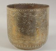 AN INDIAN ENGRAVED AND CHASED BRASS VESSEL, 22cm high.