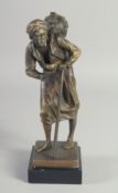 A BRONZE OF AN ARAB MAN on a marble base. 9ins high.