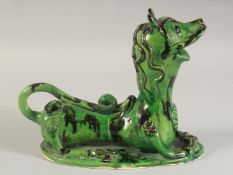 A TURKISH CANAKKALE GLAZED POTTERY LION, 25cm long.