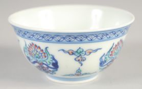A CHINESE DOUCAI PORCELAIN CUP, painted with lotus, six-character mark to base, 7cm diameter.