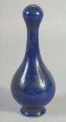 A SMALL BLUE CHINESE GARLIC NECK PORCELAIN VASE. 7ins high.