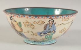 A CHINESE ENAMELLED BOWL, decorated with figures, mark to base, 17cm diameter.