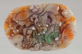A CARVED AND PIERCED MULTI JADE PENDANT.