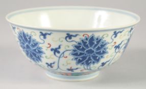 A CHINESE DOUCAI PORCELAIN BOWL, painted with lotus, Guangxu mark to base, 16.5cm diameter.