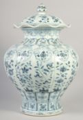 A VERY LARGE CHINESE BLUE AND WHITE PORCELAIN PETAL FORM JAR AND COVER, decorated with panels of