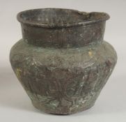 AN ISLAMIC COPPER VESSEL, with calligraphy, 17.5cm high.