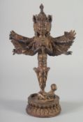 A TIBETAN GILT BRONZE FIGURE OF A MULTI ARMED DEITY. 27.5cm high.