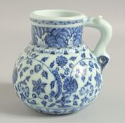 A CHINESE BLUE AND WHITE PORCELAIN JUG, with zoomorphic handle, 14cm high.