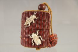 A FOUR DIVISION HARDWOOD AND BONE INRO with insects, with rope. 2.75ins.