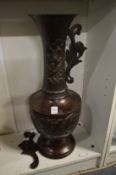 A large Japanese bronze vase (handle and upper section detached).