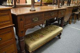 A Victorian walnut side table.