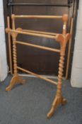 A Victorian style beech towel rail.