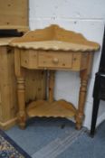 A pine corner washstand.