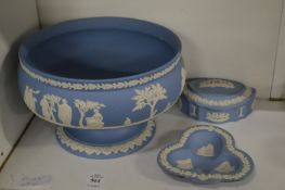 A Wedgwood blue jasperware pedestal bowl, trinket box and cover and small dish.