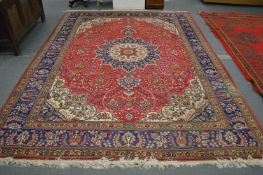 A good large Persian design carpet, red ground with floral decoration 340cm x 255cm.