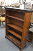 A mahogany open bookcase.
