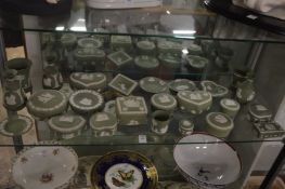 A large collection of Wedgwood green jasperware trinket boxes, dishes, vases etc.