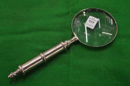 A decorative magnifying glass.