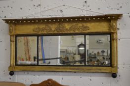 A Regency gilt framed oval mantle mirror.