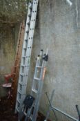 An aluminium two section ladder and two step ladders.