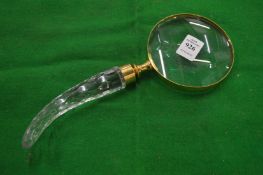 A decorative magnifying glass.