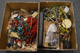 Two boxes of costume jewellery.