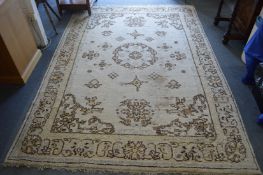 A cream ground Indian rug (worn) 275cm x 185cm.