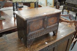 An 18th century and later miniature oak coffer.