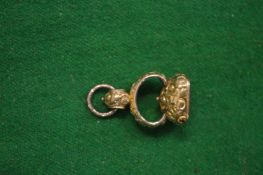 A gilt metal fob seal, matrix blank.