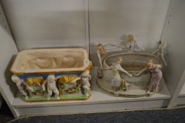 A majolica rectangular jardiniere together with a Continental porcelain jardiniere, both decorated