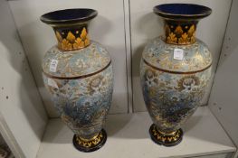 A large pair of Doulton Slaters Patent vases decorated with stylised leaves and flowers (chips to