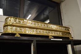 A pierced brass fender.