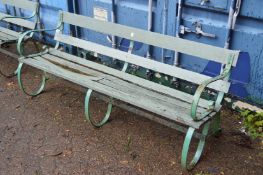 A large wrought iron and wooden garden bench (some wooden parts rotten).