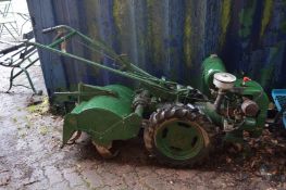 A large petrol rotavator.